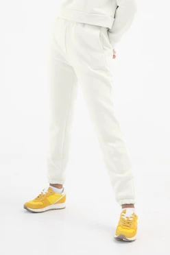 Купить брюки Итан из футера женские, однотонные молочные