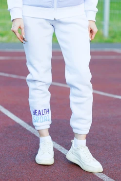 Купить брюки Хит из футера женские, однотонные "Health Sport"